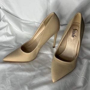 Super cute nude/tan colored heels. Never worn.